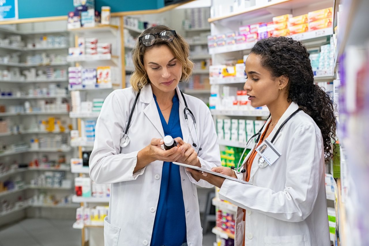 two-pharmacists-working-together-at-pharmacy.jpg